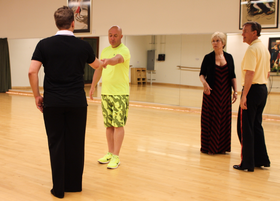 West coast swing instructor Jamie Bayard demonstrates the females’ steps together with dancer Nigel Clarke.