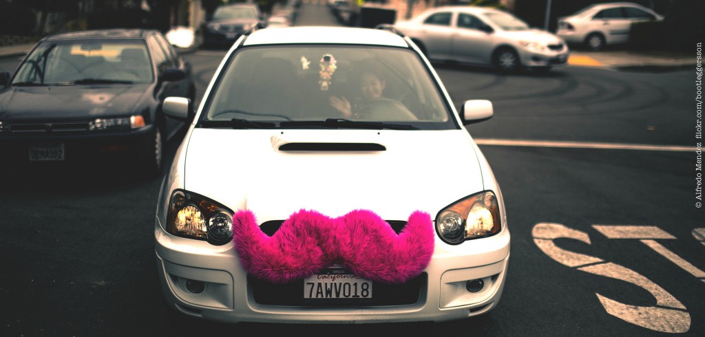 Lyft car with the signature pink moustache