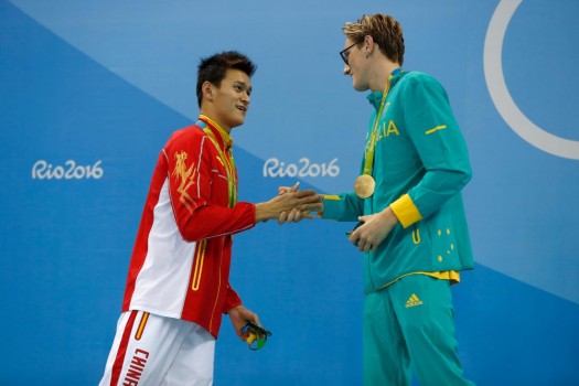 RIO DE JANEIRO, BRAZIL - AUGUST 06: (L-R) Silver medalist Yang Sun of China and gold medal medalist Mack Horton of Australia pose during the medal ceremony for the Final of the Men's 400m Freestyle on Day 1 of the Rio 2016 Olympic Games at the Olympic Aquatics Stadium on August 6, 2016 in Rio de Janeiro, Brazil. (Photo by Clive Rose/Getty Images)