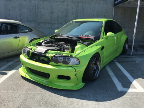 A modified Green BMW parked in the car show. Is it legal to drive on the road?