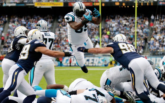 Carolina Panthers fullback Mike Tolbert scores against the San Diego Chargers  during the first half of a NFL football game Sunday, Dec. 16, 2012, in San Diego. (AP Photo/Gregory Bull)